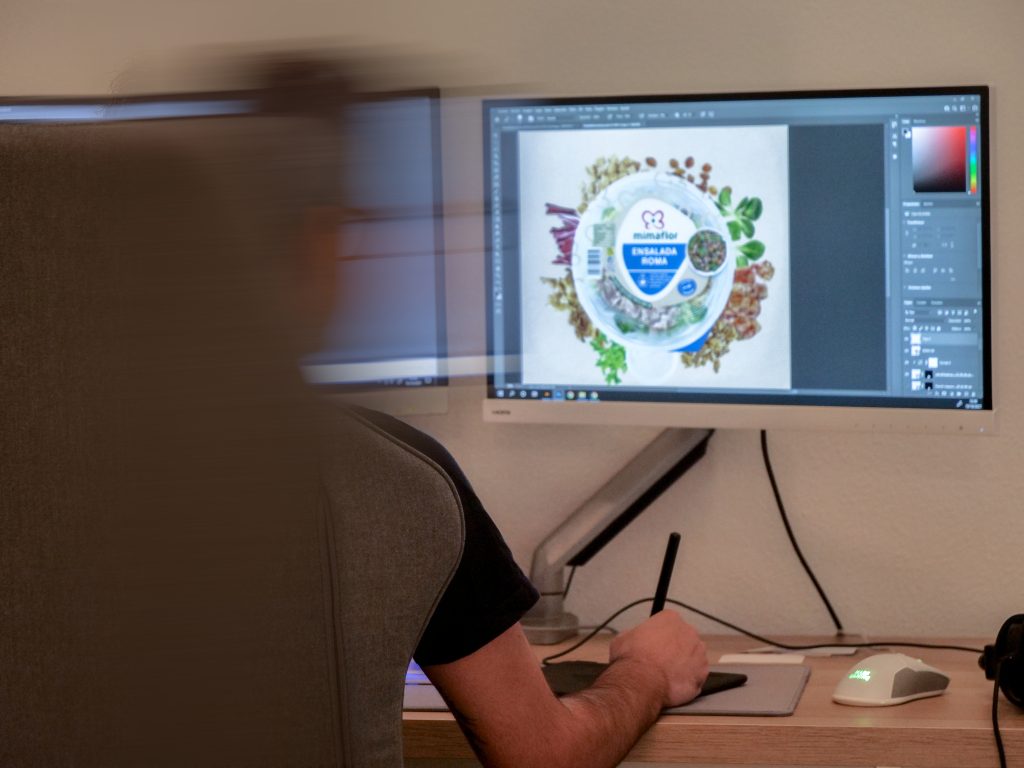 Graphic designer working on packaging - What graphic design is